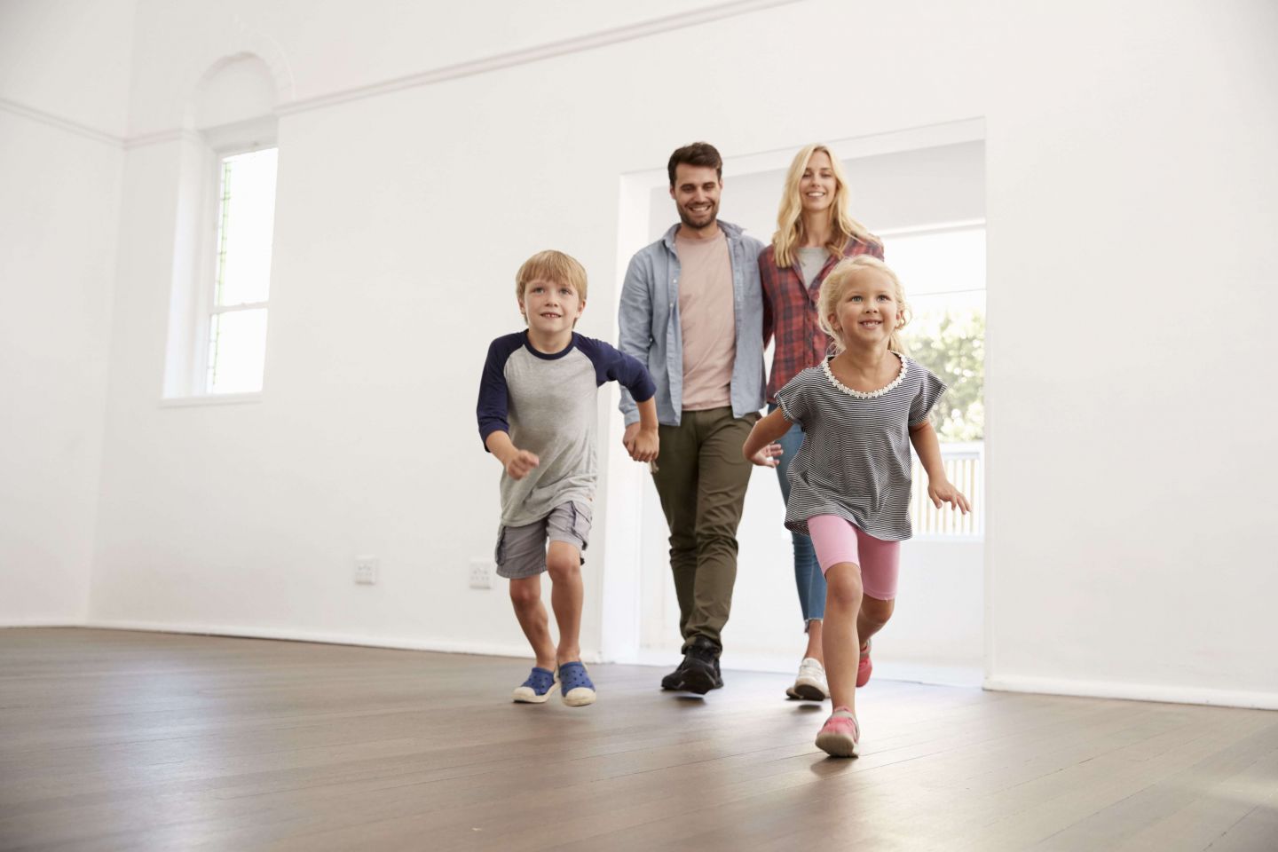 family running into new home