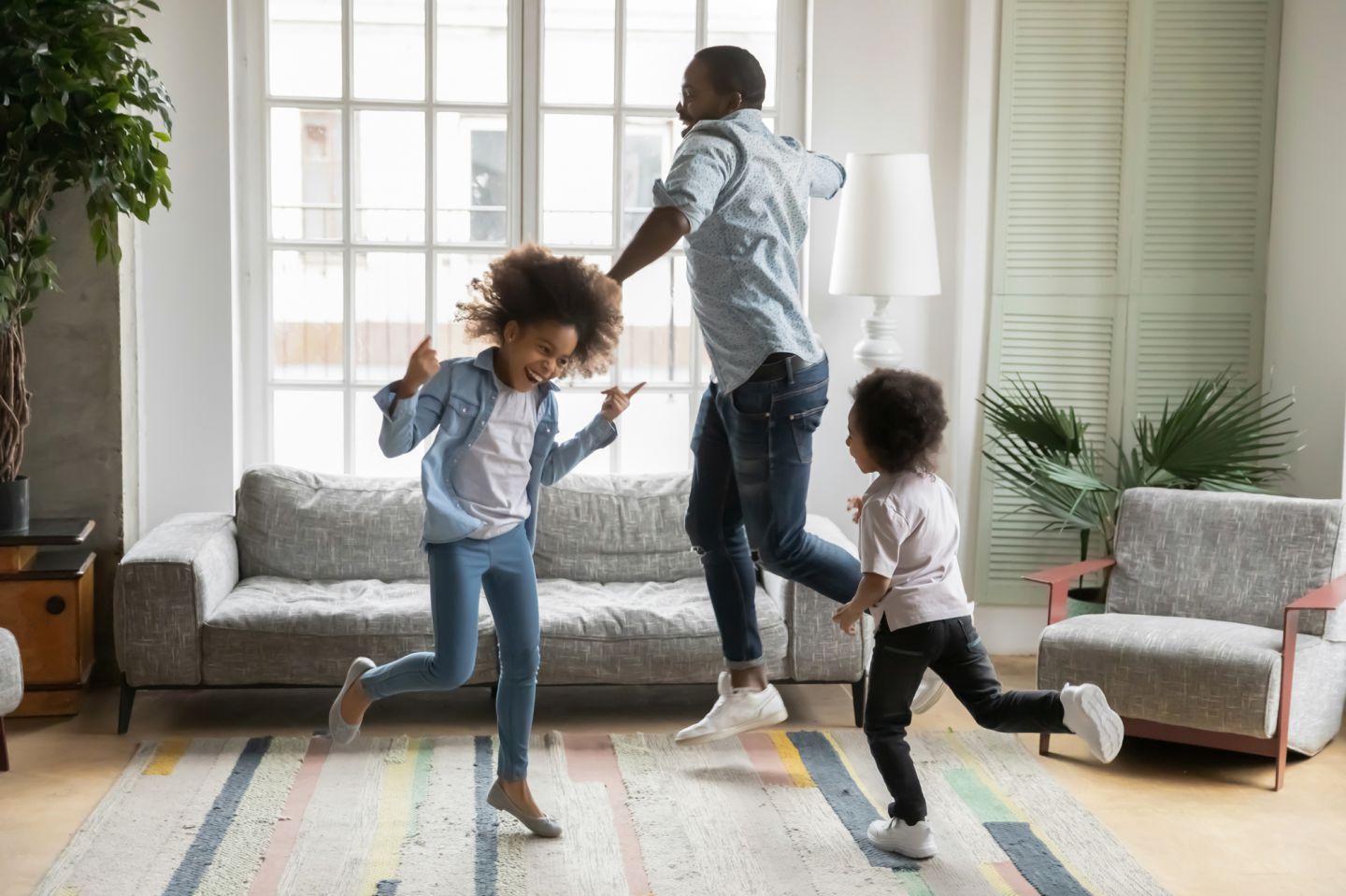 Happy family dancing at home